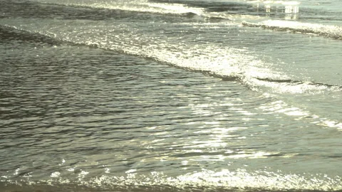 Texture Of Water And Sand. Bright Golden Sand. Waves Break On The Sandy Shore Video stock 112591981