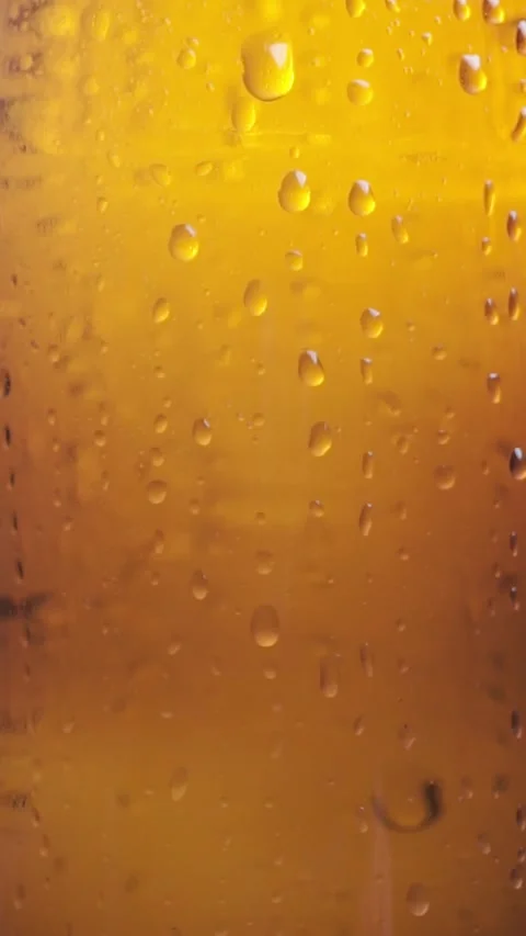 Texture water drops on bottle beer. Close-up of a beer bottle Stock Footage 318072041