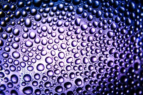 Texture of water drops on bottle Stock Photos