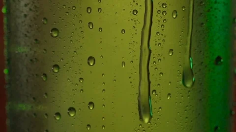 Texture water drops on the green bottle of beer. Stock Footage 77824948