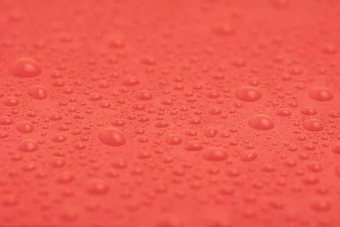 Texture of water drops on red plastic. Stock Photos