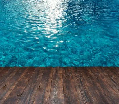 Texture of the water in the pool and place for text on a wooden background Stock Photos