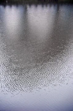 The texture of the water in the river under the influence of wind. A lot of s Stock Photos