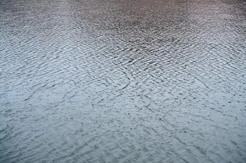 The texture of the water in the river under the influence of wind. A lot of s Stock Photos