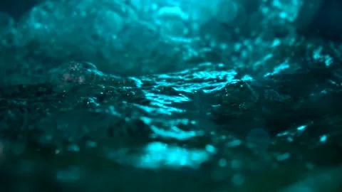 Texture of the water is a rumbling chaos with bubbles created Stock Footage 310669157