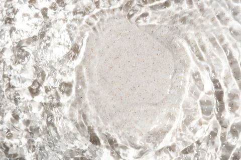 The texture of water on a sand background. Stock Photos