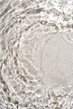 The texture of water on a sand background. Stock Photos