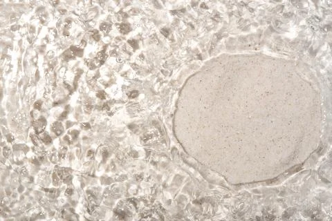 The texture of water on a sand background. Stock Photos