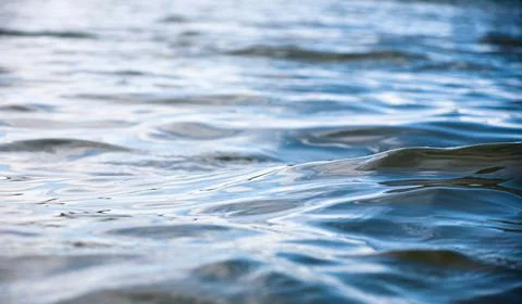 Texture of water surface of blue, waves . Stock Photos