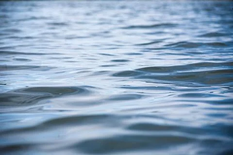 Texture of water surface of blue, waves . Stock Photos