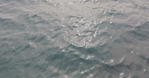 Texture of water surface of sea reflection of sun's rays. Sun glare on water 스톡 동영상 154334707