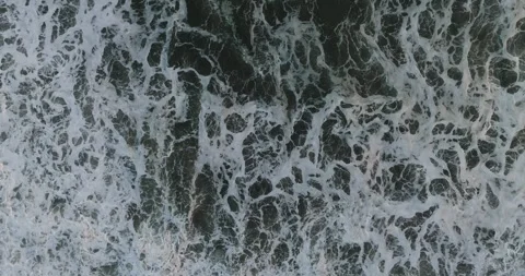 Texture of water surface of sea reflection of sun's rays. View from drone Stock Footage 243877832