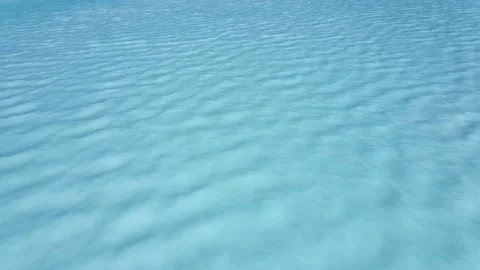 Texture of water turquoise surface of sea reflection of sun's rays Stock Footage 136436947