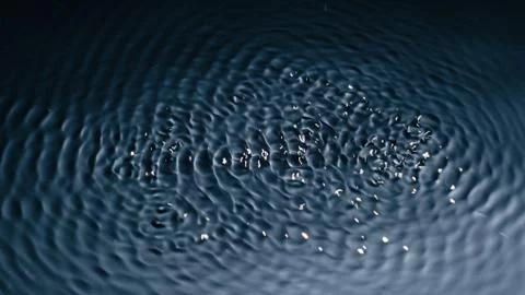 The texture of water under the influence of vibration in 432 hertz Stock Photos