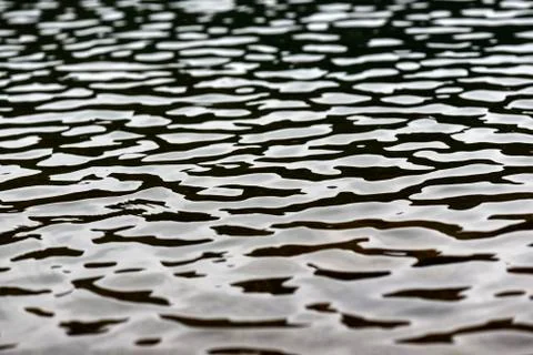 Texture of water, wind making wrinkles of water. Stock Photos