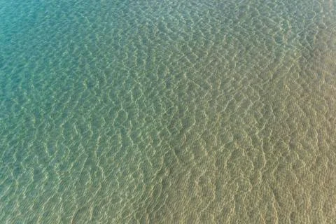 Texture of the waves of the calm sea Stock Photos