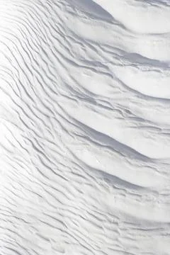 Texture of waves on surface of gray and white stone. Stock Photos