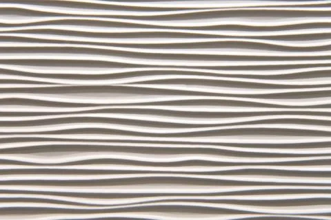 Texture of wavy lines of an abstract geometric shape surface, background Stock Photos