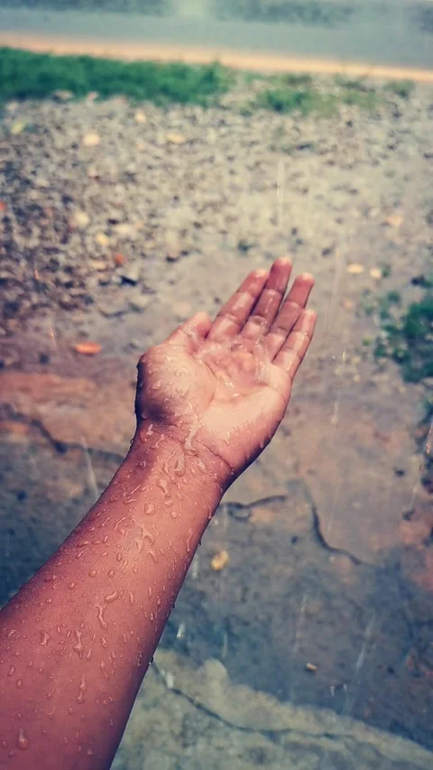 The texture of wet hands under the rain. Vertical footage. Stock Footage 292514603