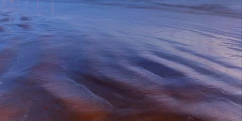 Texture of wet sand beach Stock Photos
