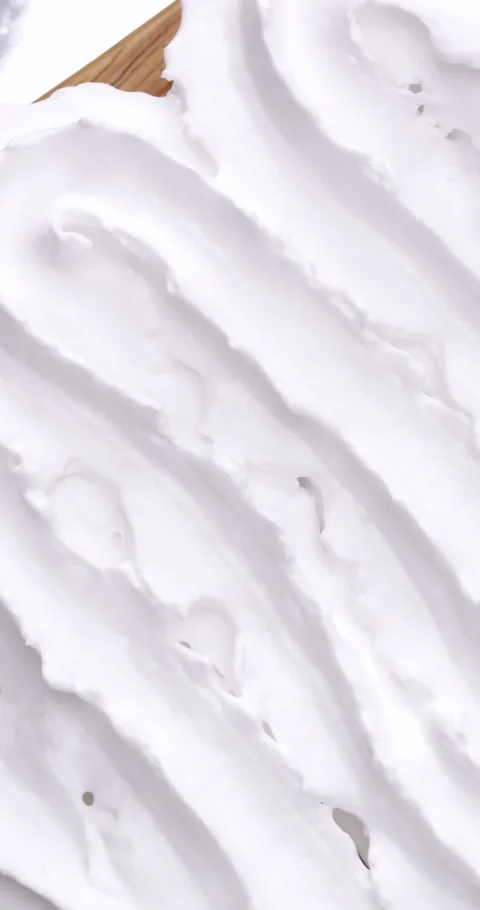 Texture whipped cream onto bread. Stock Footage 255256515