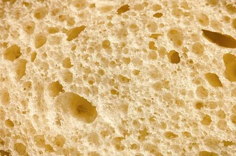 Texture of white bread as a close up background. backdrop of rough dappled .. Stock Photos