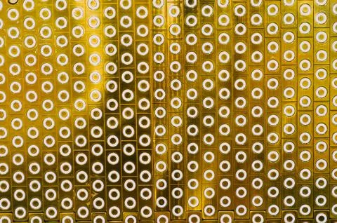 Texture white circles in rectangular scarves of gold coating background. Stock Photos