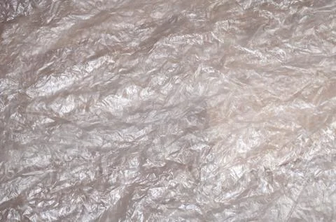 Texture of white crumpled cellophane surface transparent on sunlight. Concept Stock Photos