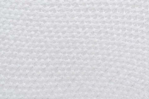 Texture of white mesh fabric. Background of light mesh fabric Stock Photos