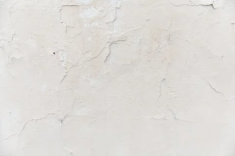Texture of a white old wall with cracks and peeled paint Stock Photos