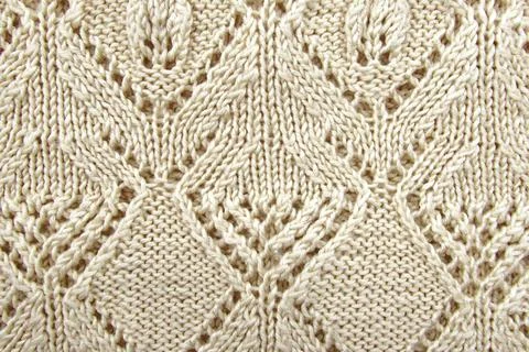 Texture of white or gray knitted material. Knitting Stock-Fotos