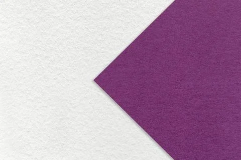 Texture of white paper background, half two colors with violet arrow, macro. Stock Photos