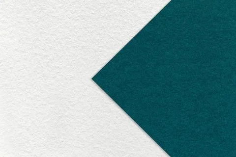 Texture of white paper background, half two colors with emerald arrow, macro Stockfoto's