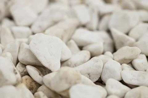 Texture of white pebbles as background, closeup Stock Photos