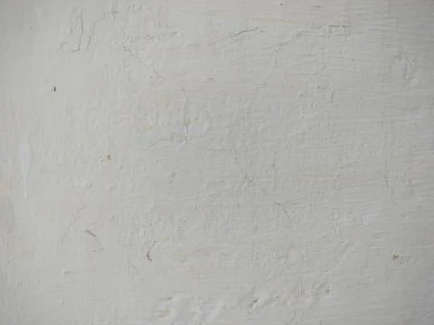 Texture of white plaster on a concrete wall handmade. Old White Wall Texture. Stock Photos
