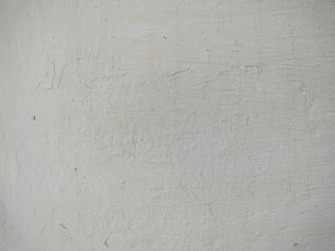 Texture of white plaster on a concrete wall handmade. Old White Wall Texture. Stock Photos