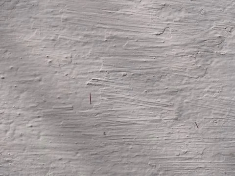 Texture of white plaster on a concrete wall handmade. Old White Wall Texture. Stock Photos