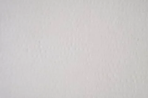 Texture of white polymer packaging material, abstract background. Photos