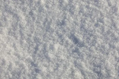 Texture of white snow on the ground. Stock Photos