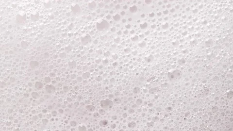 Texture of white soap foam with bubbles abstract background. Vídeo Stock 147385732