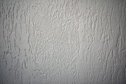 The texture of the white wall - decorative plaster. Stock Photos
