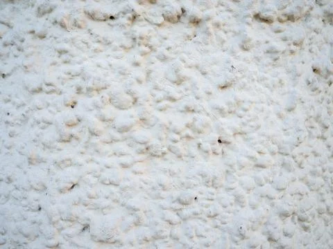 The texture of the white wall in plaster. Uneven  surface Stock Photos