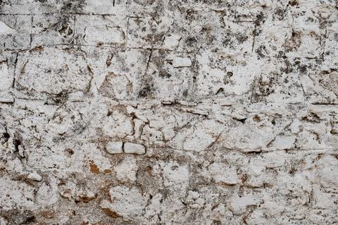 Texture of whitewashed stone wall with scuffs and irregularities Stock Photos