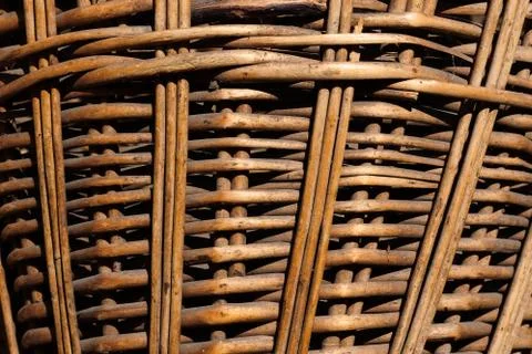 Texture of a wicker basket close-up. Abstract background with a wood pattern. Stock Photos