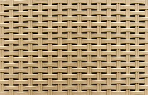 Texture of wicker plastic basket. Background for design and decoration. Stock Photos