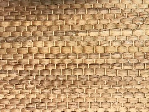 Texture of wicker straw, napkin on the table, natural background Stock Photos