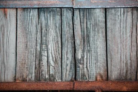 Texture of a wooden array on a frame of a metal corner Stock Photos