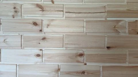 The texture of a wooden pine wall with a pattern in the form of bricks. Foto stock