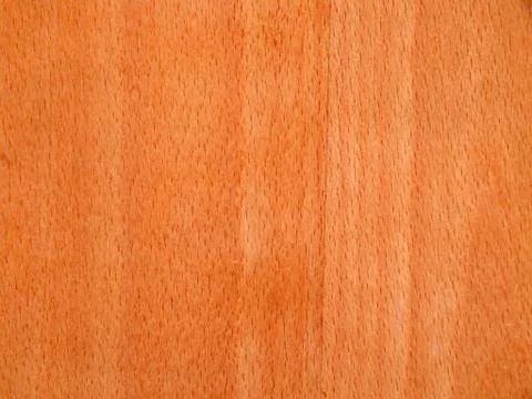 Texture of a wooden surface of a cherry tree. Wood veneer for furniture Stock Photos