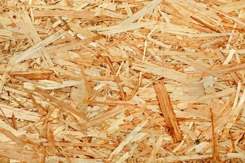 The texture of the wooden surface of pressed chips and sawdust closeup. Foto stock